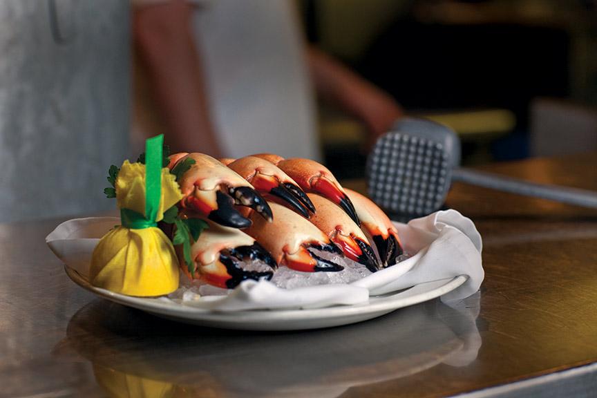 picture of Florida Stone Crab claws on a plate, being served