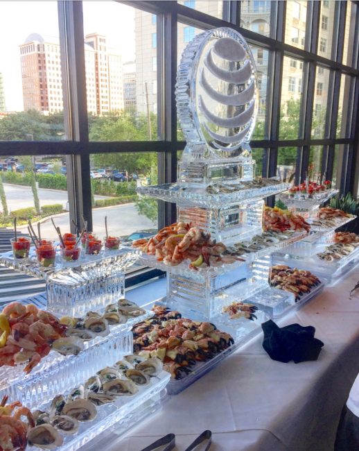 picture of Dallas private event with ice sculpture and chilled seafood display to include ahi tuna, oyster, shrimp cocktail and fresh crab claws