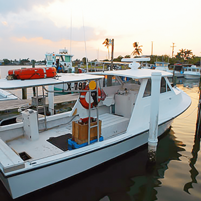 picture of stone crab fishing boat docked in the water