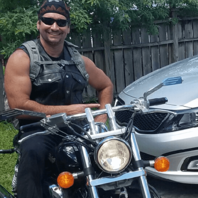 picture of Chef Odel on his motorcycle with sunglasses on