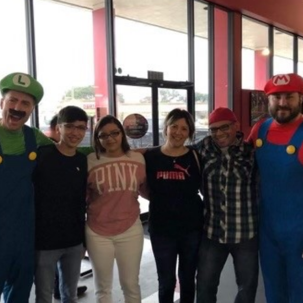 photo of Chef Misael and his family at the employee cultural celebration with Dave Mattern and Sami Canaan